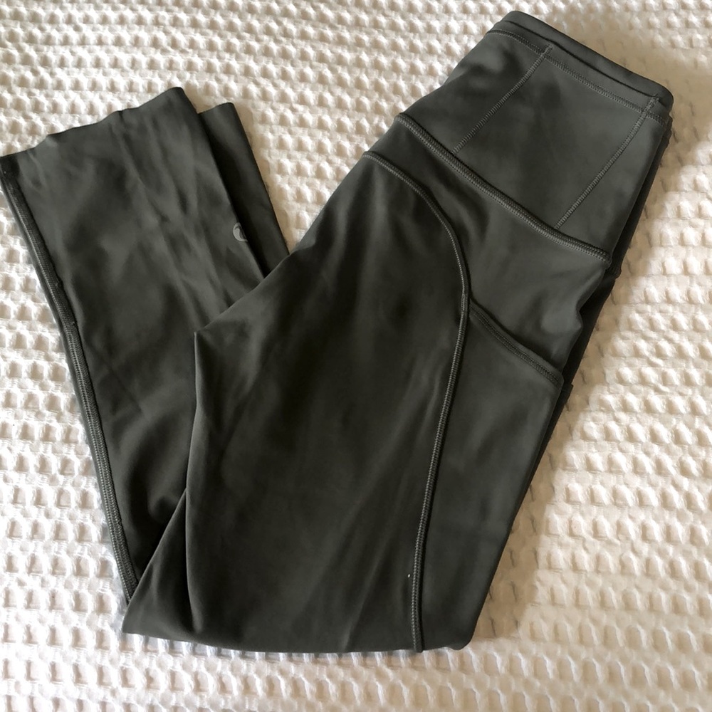 Super cute Olive color Lululemon cropped leggings, size 2, with pockets.